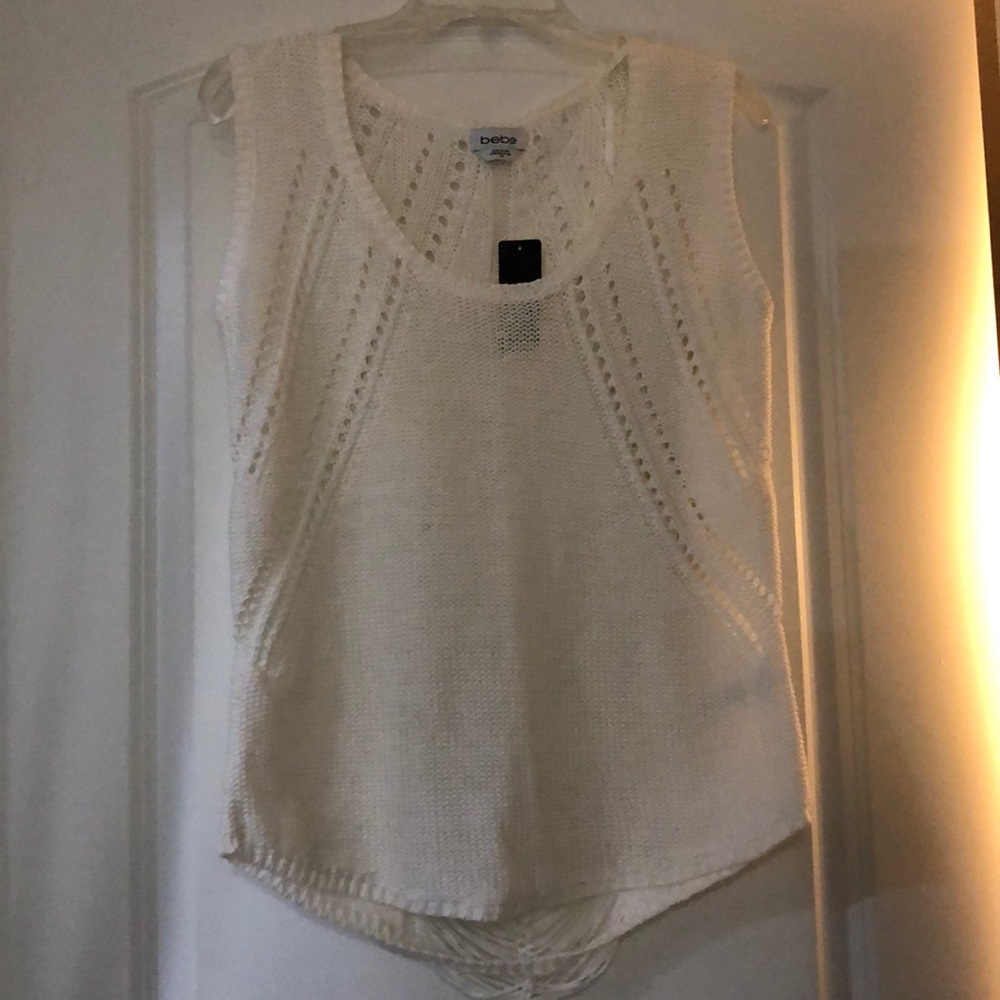 White sleeveless sweater